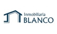 Logotip de Inmobiliaria blanco Torrelavega